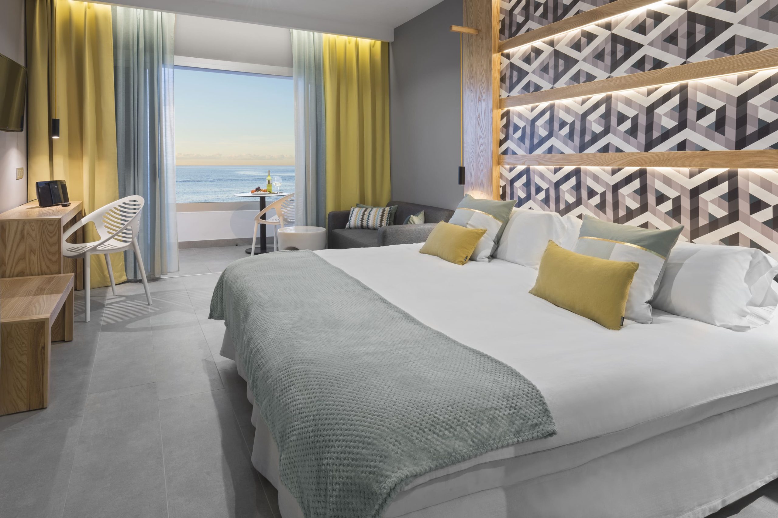 Hotel bedroom furniture with custom headboard at Atlantic Mirage hotel in Tenerife