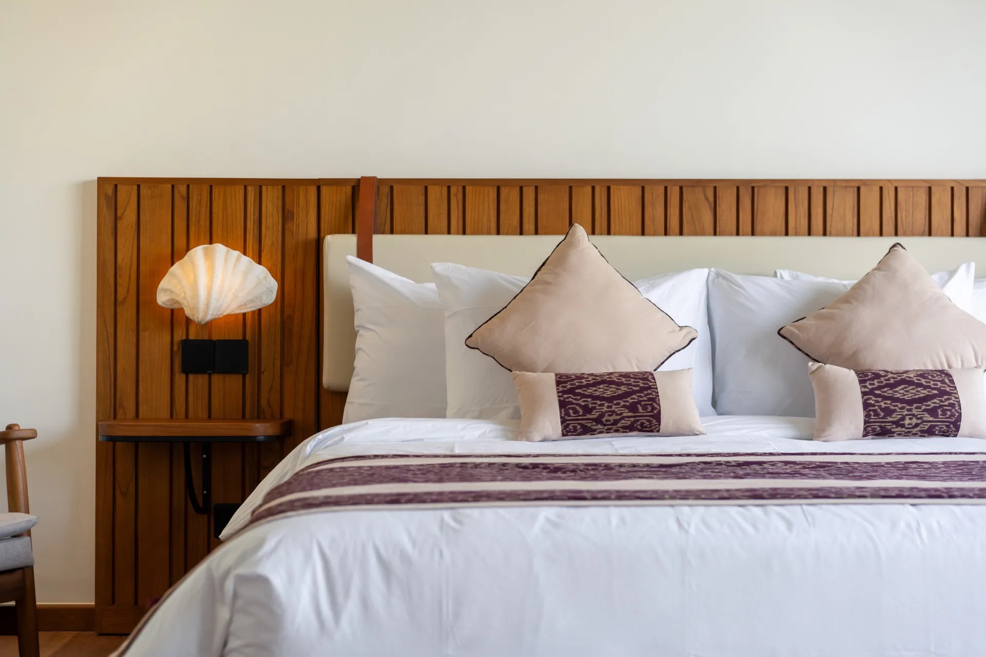Close up of fixed headboard in bedroom at Villa Charleston in Bali