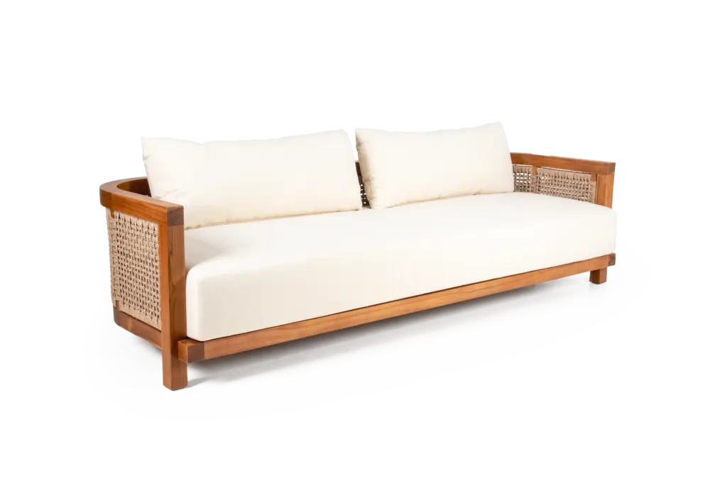 AUREA sofa made of teak with woven loom backrest and white fabric-upholstered seating in three-quarter view