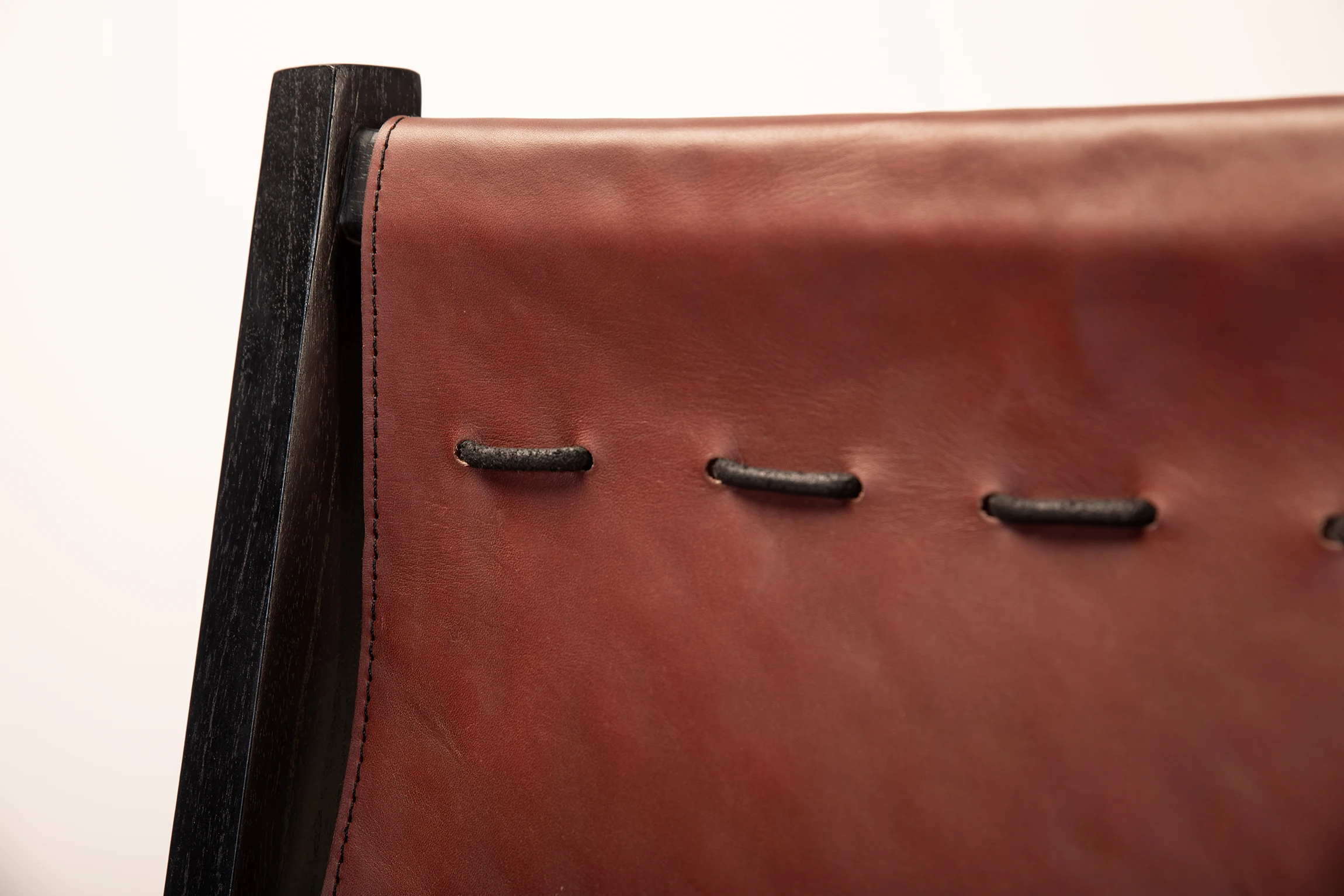 Close up of Marseille Dining chair backrest made of leather from the leather collection