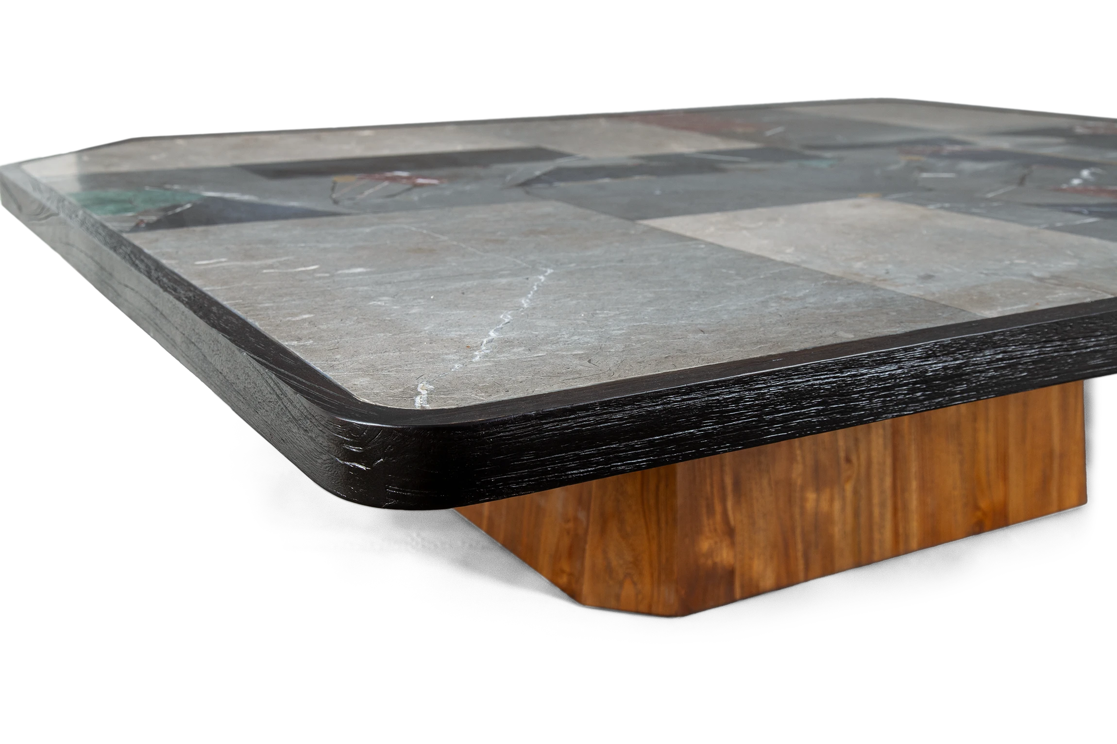 Close up of AVILA coffee table made of teak with grey stones and brass with teak frame in the foreground