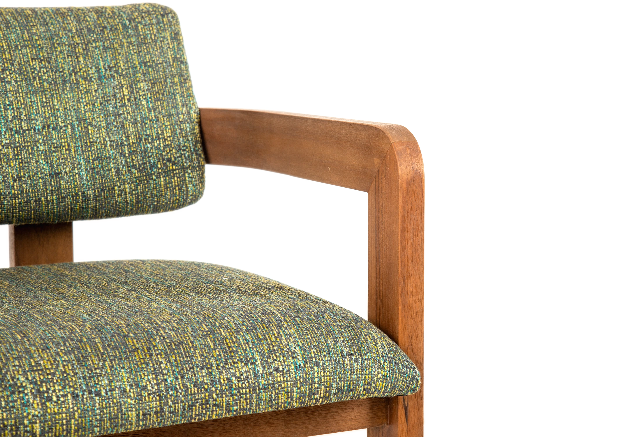 Close-up of DOM armchair made of teak with green upholstered seating