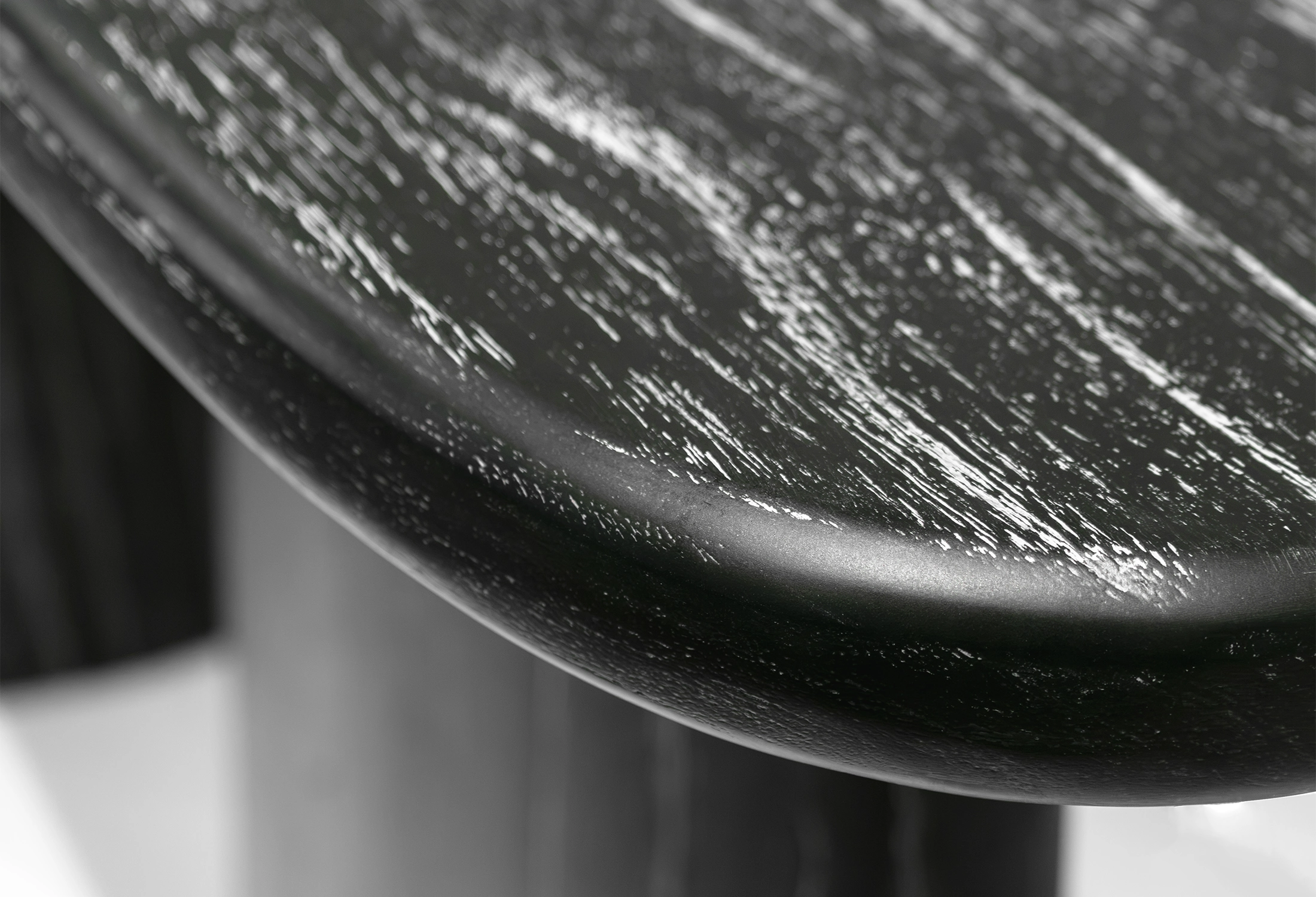 Close-up of the texture and color of MARINA console table made of black Java oak
