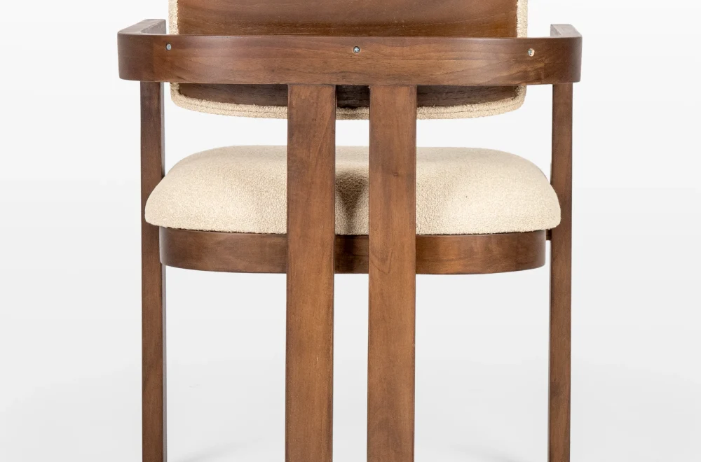 DOM dining chair made of teak with fabric upholstered seating viewed from the back from architectural lines collection