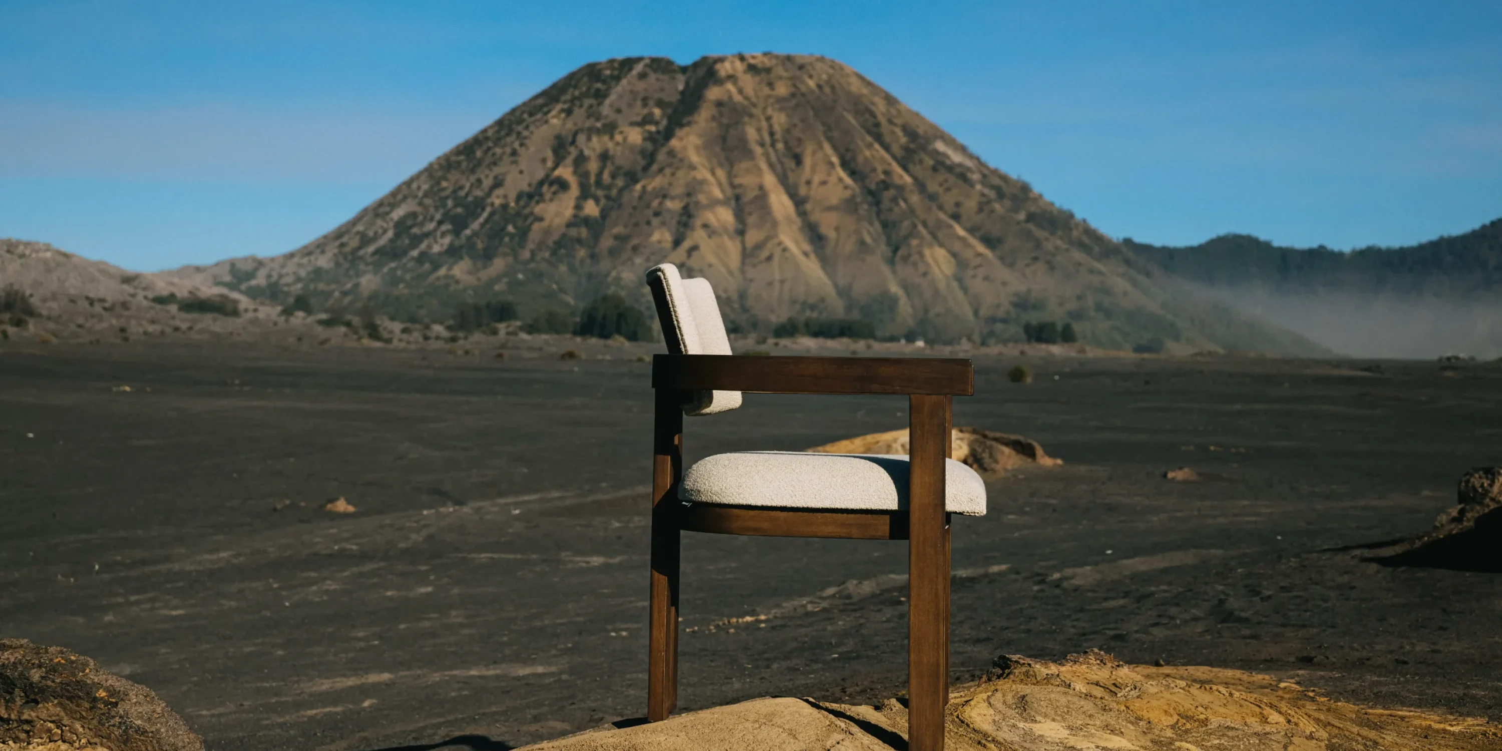 DOM armchair made of teak and white upholstered seating in mount bromo.