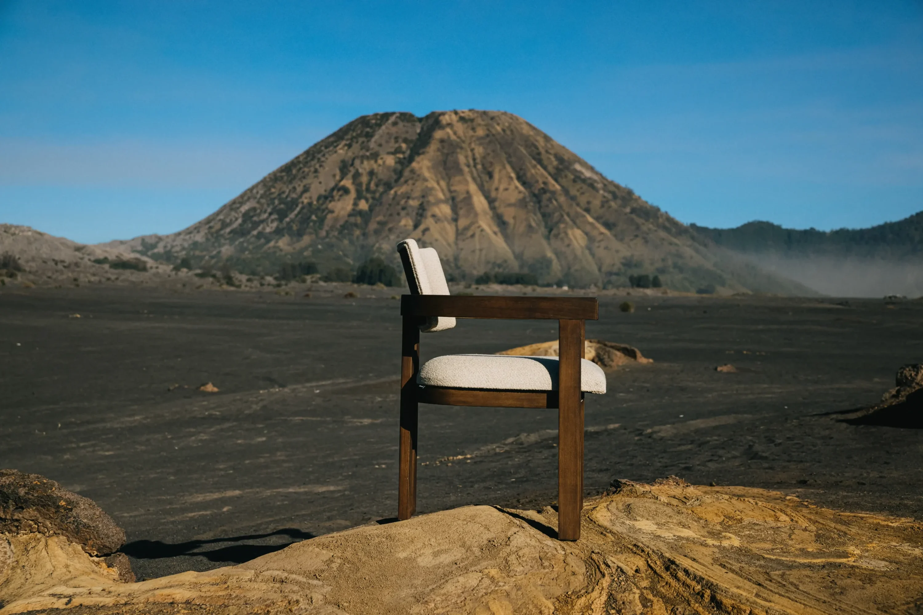 DOM armchair made of teak and white upholstered seating in mount bromo.