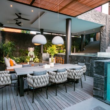 Outdoor dining set next to the pool from Villa Mar 1 project in Bali furnished by Tab&uacute; Design